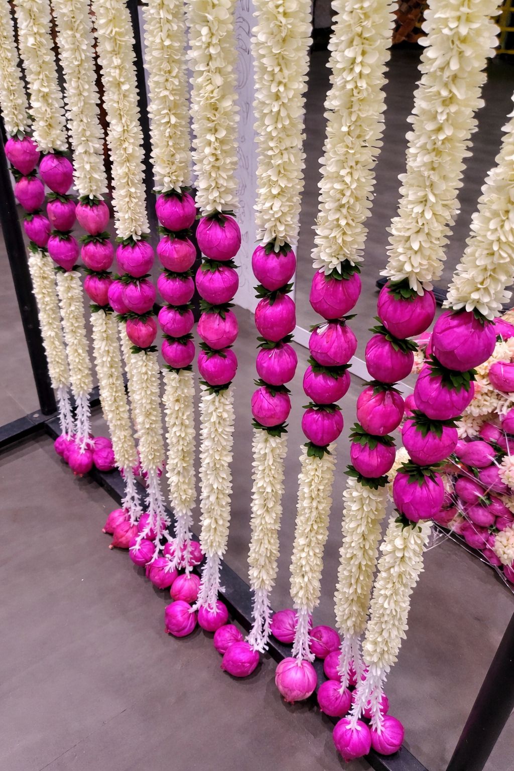 White lily and pink lotus bud garlands